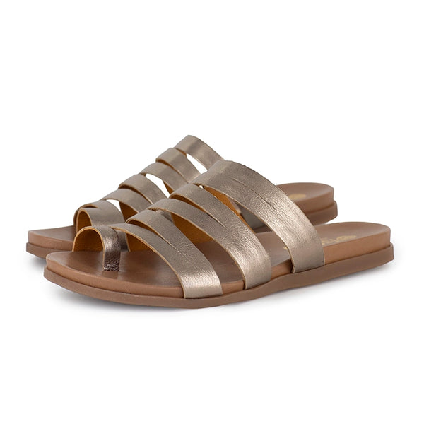 Pair of metallic sandals on a white background