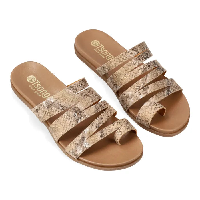 Pair of sandals with snake print straps on a white background