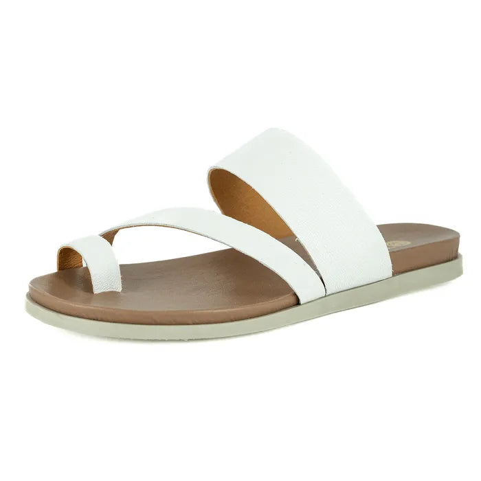 White sandal with brown sole on a white background
