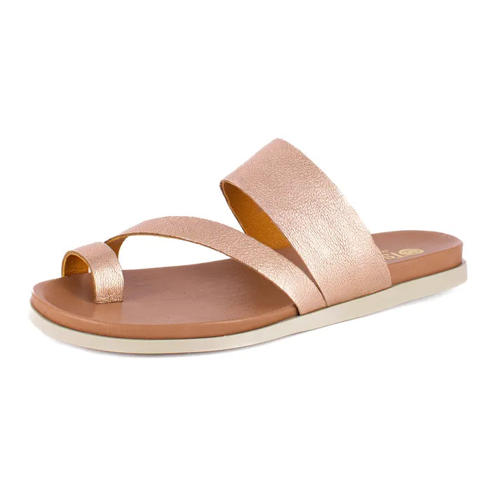 Rose gold sandal with a white sole on a light beige background