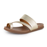 Gold sandal with a tan sole on a white background