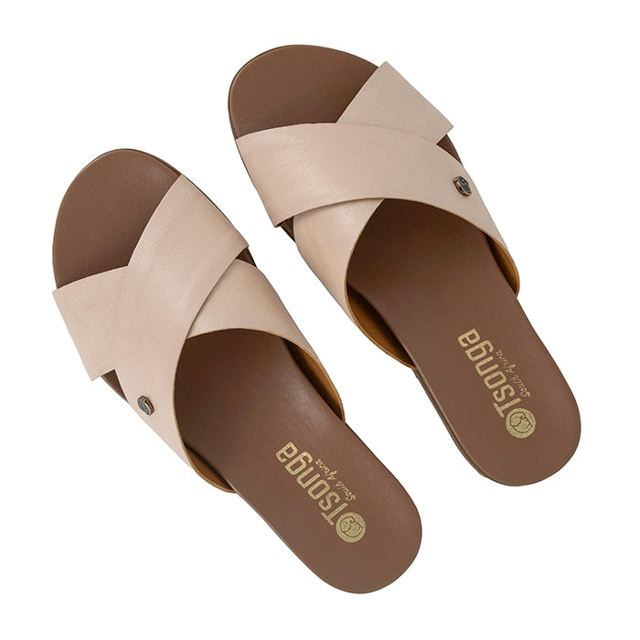Pair of beige sandals with tan soles on a white background