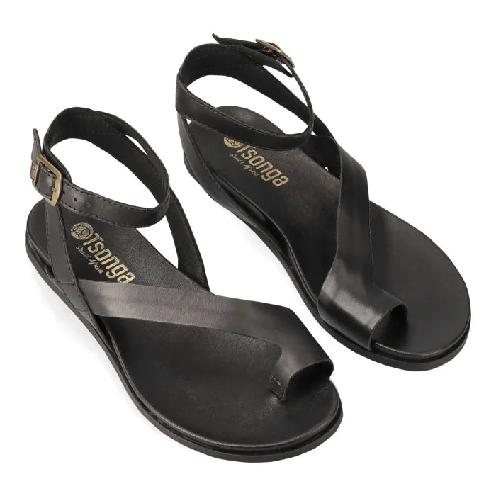 Pair of black sandals with ankle strap on a white background