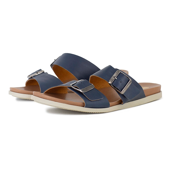 Pair of blue sandals with brown soles on a white background