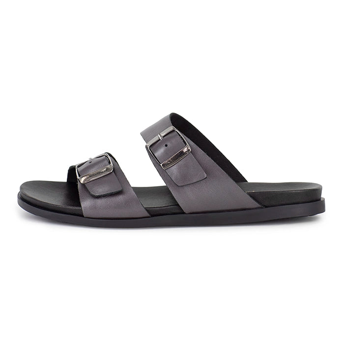 Silver sandal with two buckles on a white background