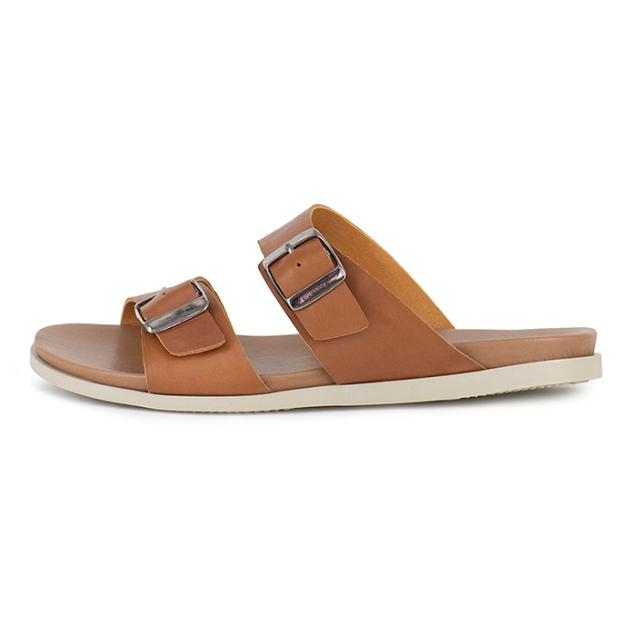 Tan sandal with buckles on a white background
