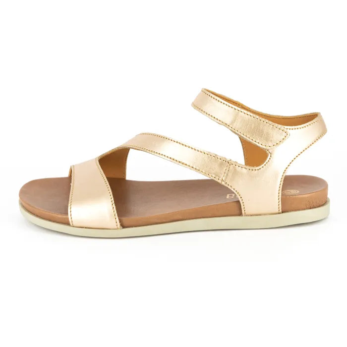 Gold sandal on a white background