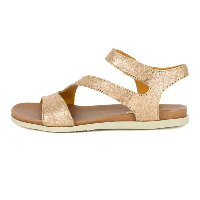 Gold sandal with criss-cross straps on a white background