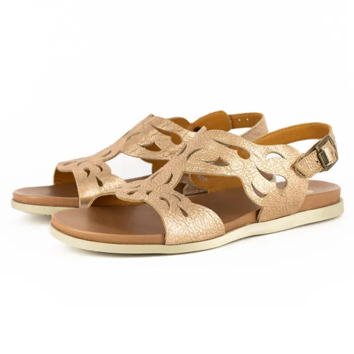 Gold sandals with cut-out design on a white background