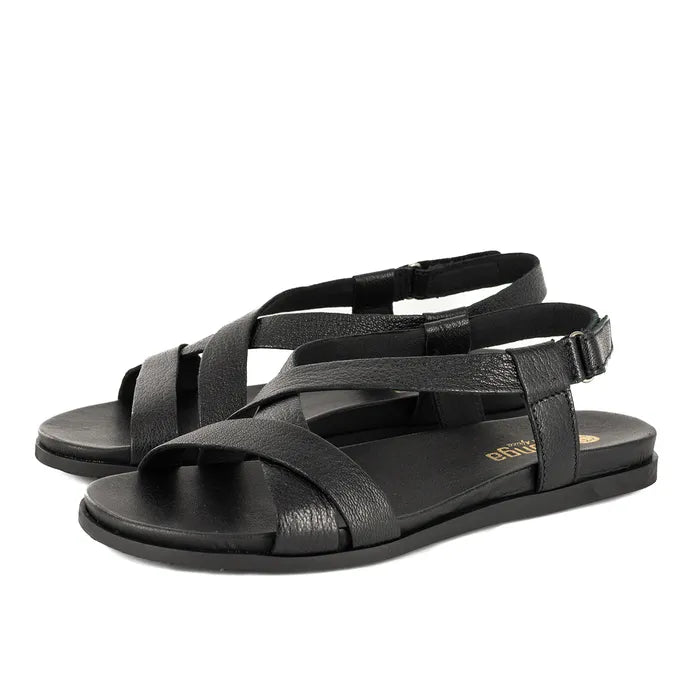 Black sandals with criss-cross straps on a white background