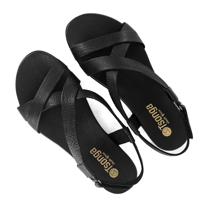 Black sandals with criss-cross straps on a white background