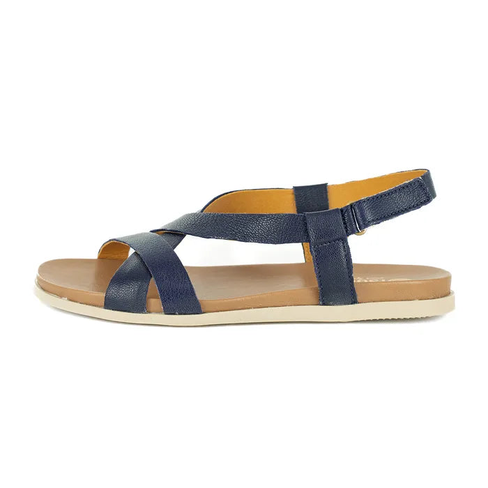 Navy sandal with tan sole on a white background