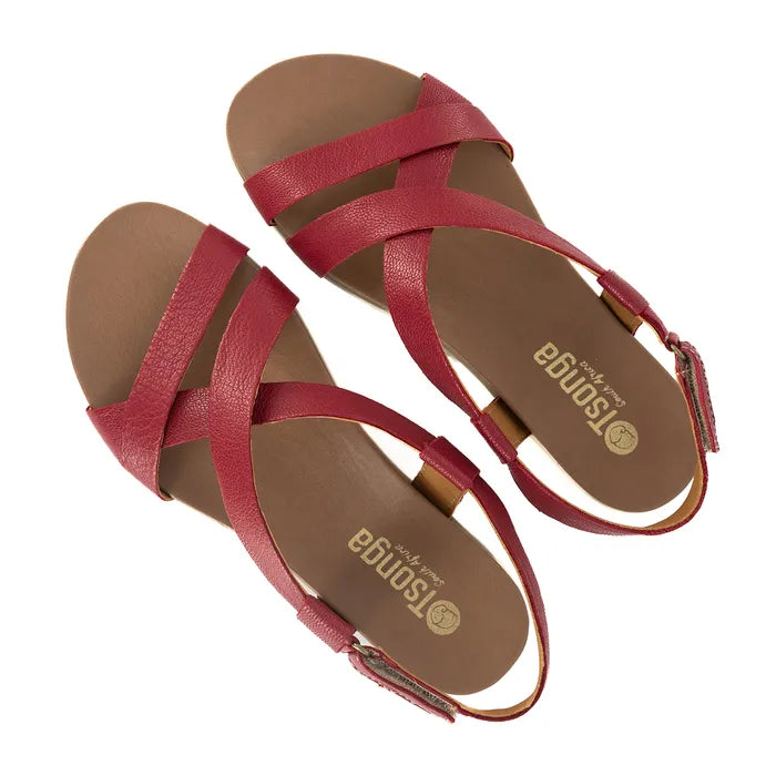 Red sandals with 'Tsonga' branding on a white background