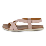 Pink sandal with criss-cross straps on a white background