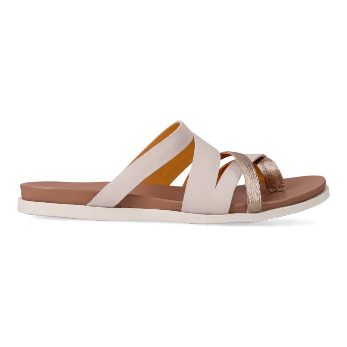 Single sandal with cream strap and tan sole on a white background