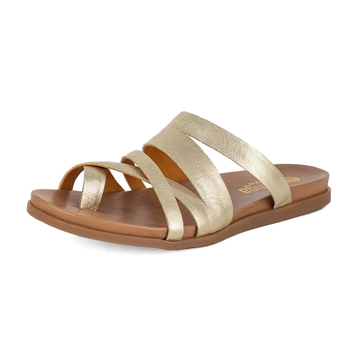 Gold sandal with a tan sole on a white background