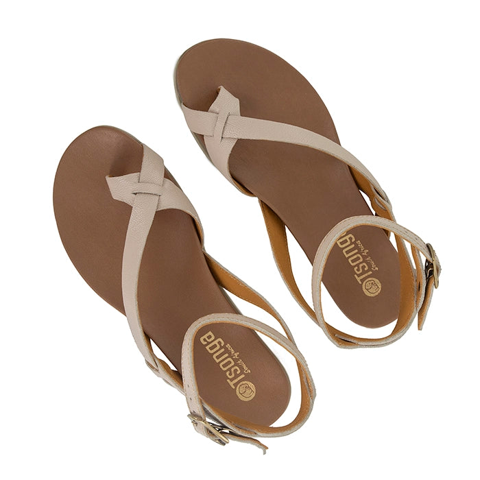 Beige sandals with brown soles on a white background