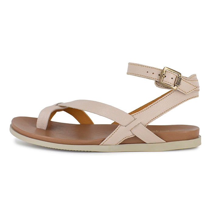Beige sandals with brown soles on a white background