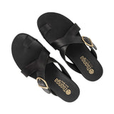 Black criss cross sandals with gold buckles on a white background