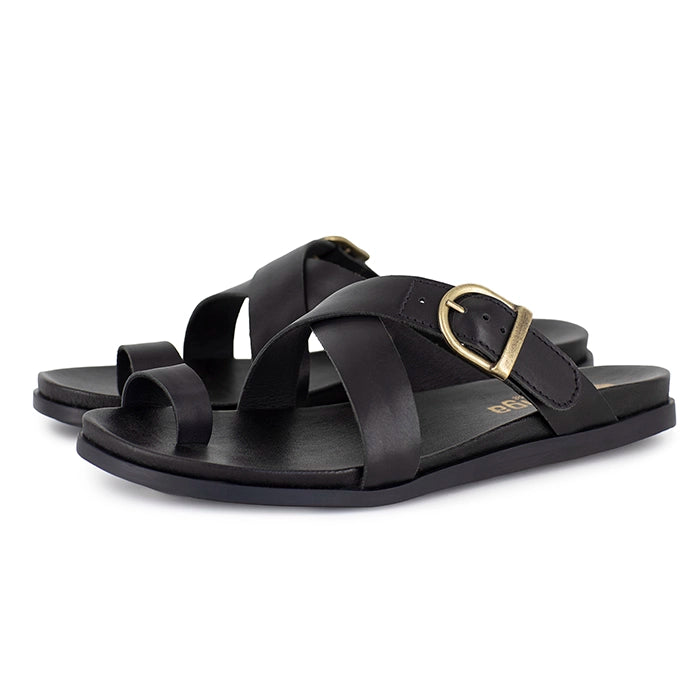 Black criss cross sandals with a gold buckle on a white background