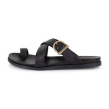 Black criss cross sandal with a gold buckle on a white background