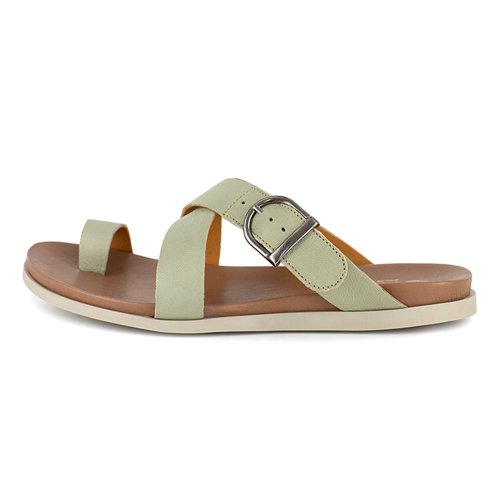 Light green sandal with a brown sole on a white background