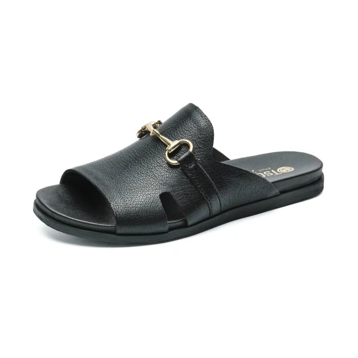 A single black leather slide sandal with a gold-tone horsebit detail on the strap, shown in a side profile against a white background. The brand name 'Tsonga' is visible in gold lettering on the heel of the footbed.