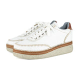 White sneakers with brown accents on a white background