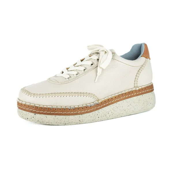 Cream sneaker with brown accents on a white background