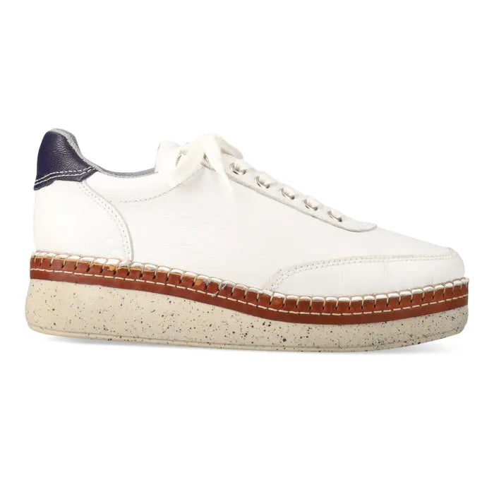 White sneaker with wedge sole on a white background