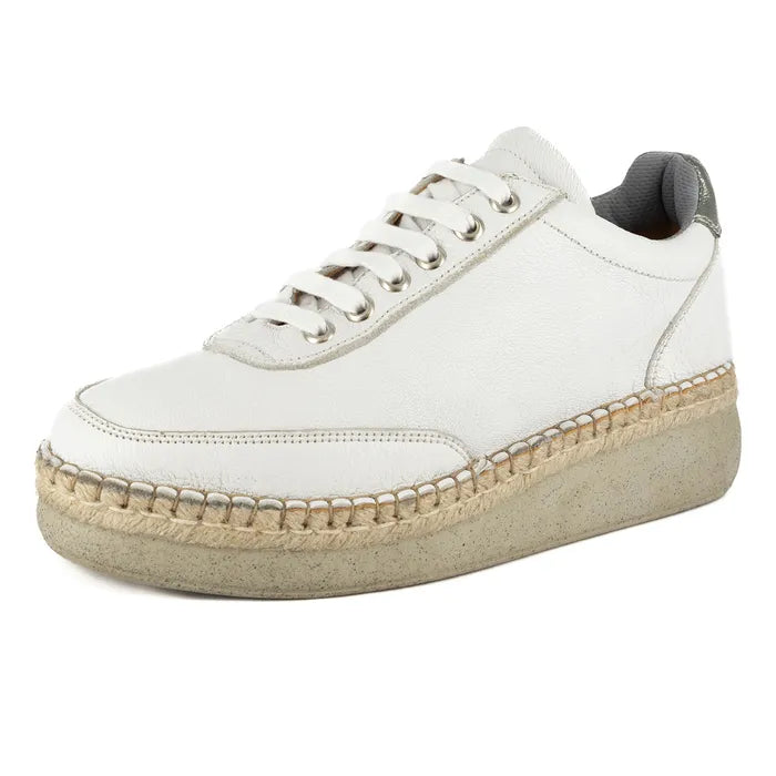 White sneaker with a textured sole on a white background