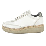 White sneaker with a textured sole on a white background