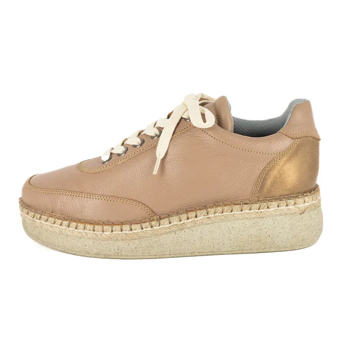 Beige sneaker with a textured sole on a white background