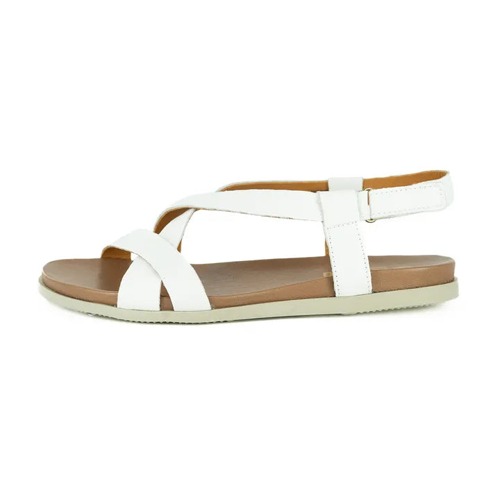 White sandal with brown sole on a white background