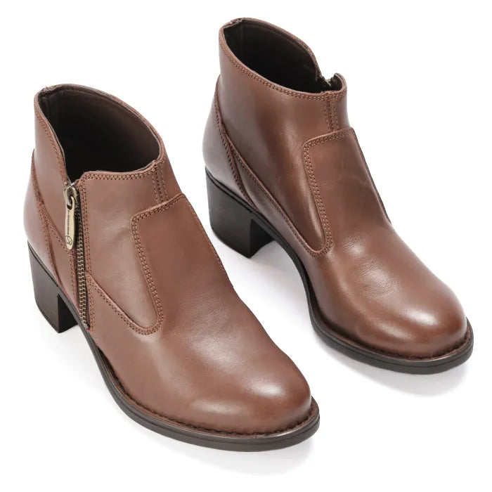 Pair of brown leather ankle boots on a white background