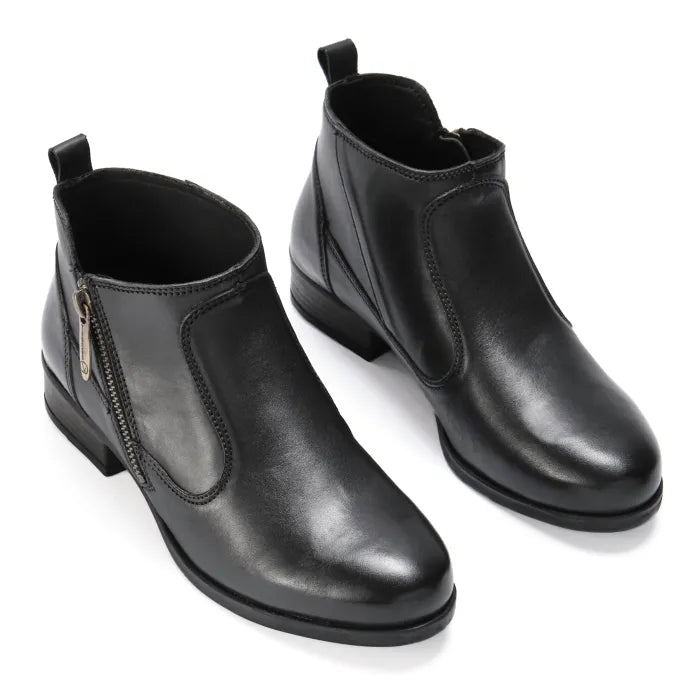 Pair of black leather ankle boots on a white background
