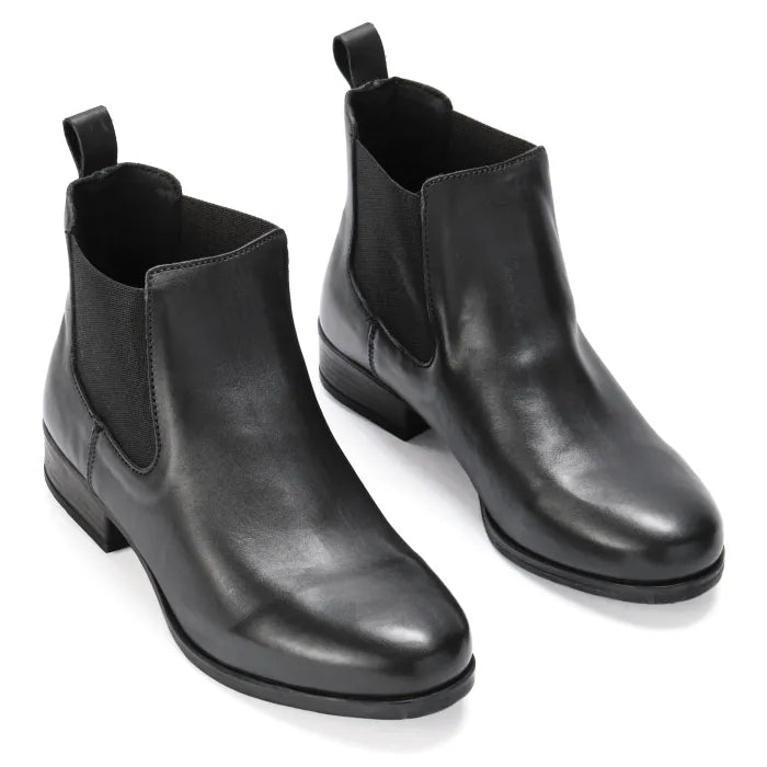Pair of black leather Chelsea boots on a white background