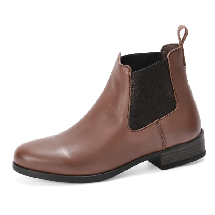 Brown leather Chelsea boot with a black sole on a white background