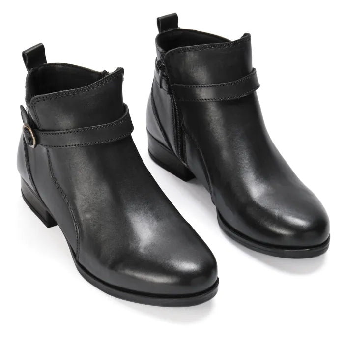 Pair of black leather ankle boots on a white background