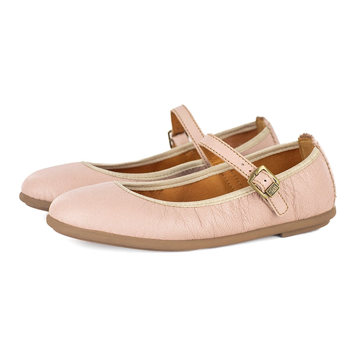 Pair of light pink pumps with a strap on a white background