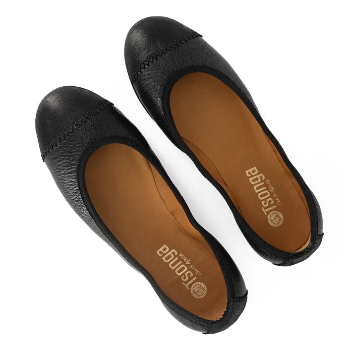 Pair of black flat shoes with brown soles on a white background