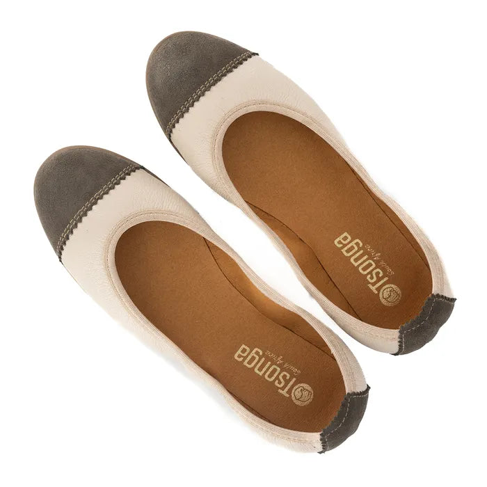 Pair of flat shoes with brown and beige color scheme on a white background