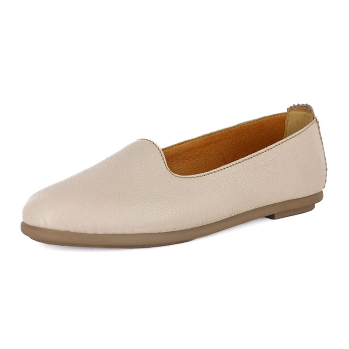 Cream flat shoe on a white background