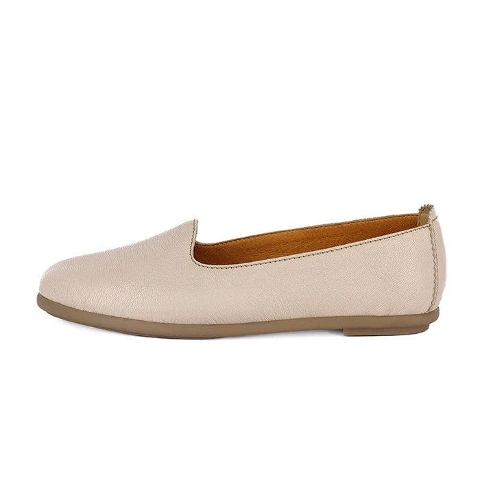 Cream flat shoe on a white background