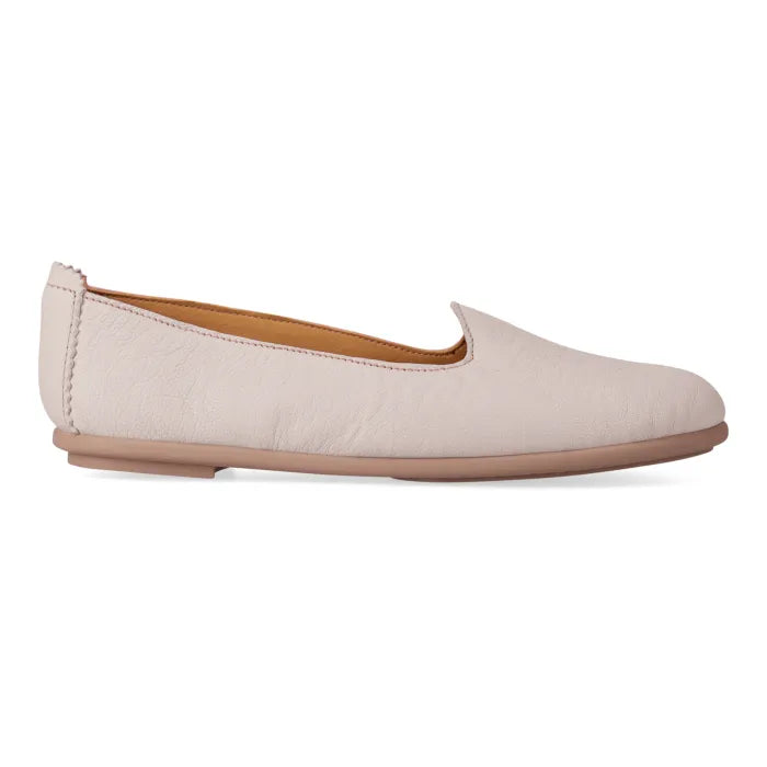 Beige flat shoe on a white background