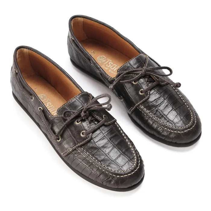 Pair of brown leather boat shoes on a white background