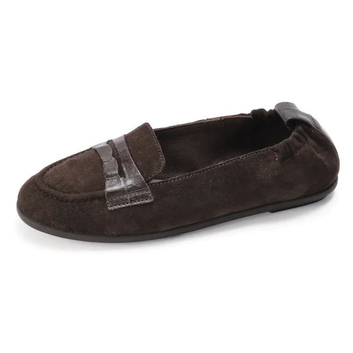 Brown suede loafer with a strap on a white background