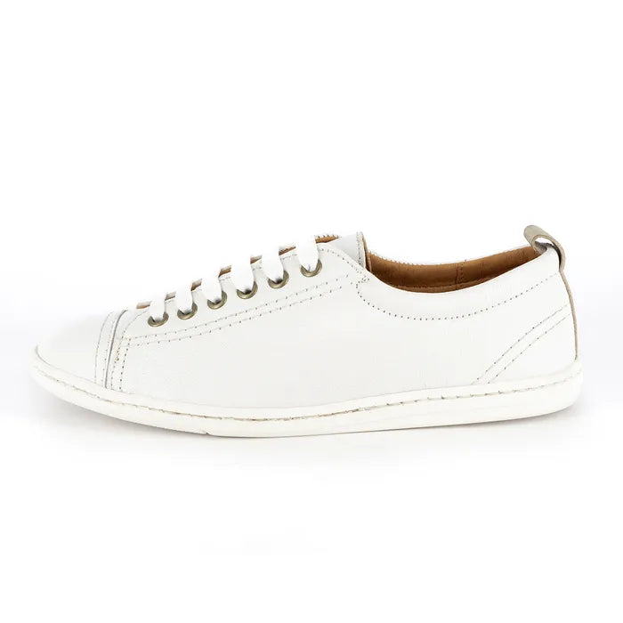 White sneaker with brown lining on a white background