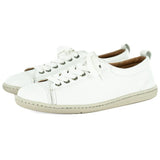 Pair of white sneakers on a white background