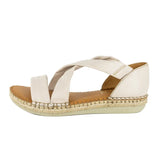 Beige sandal with espadrille sole on a white background